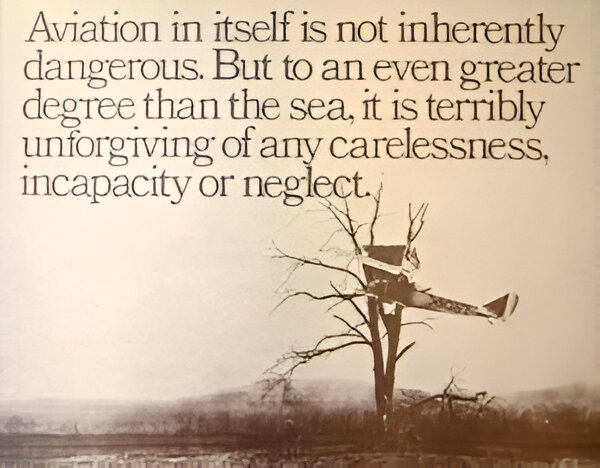 An image of a propeller plane stuck in a tree, with the accompanying text being - Aviation in itself is not inherently dangerous. But to an even greater degree than the sea, it is terribly unforgiving of any carelessness, incapacity or neglect.